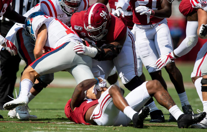 Alabama defensive lineman DJ Dale (94) stop Ole Miss quarterback John Rhys Plumlee (10) at Bryant-Denny Stadium in Tuscaloosa, Ala. Photo | Mickey Welsh / USA TODAY NETWORK