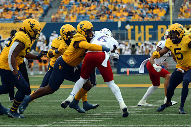 What returns for the West Virginia Mountaineers on the defensive side of the ball?