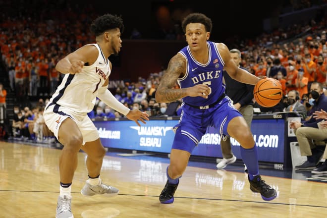 Duke's Paolo Banchero drives against Virginia's Jayden Gardner during Wednesday night's game. 