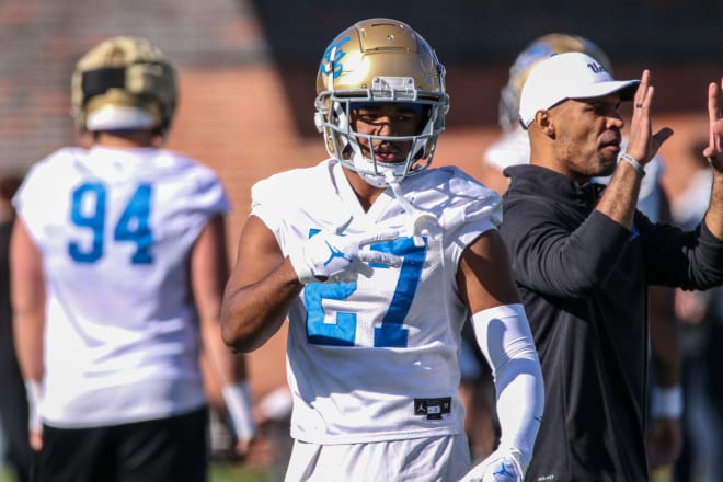 UCLA redshirt freshman safety Kamari Ramsey (27) and defensive coordinator D’Anton Lynn (right) have both decided to leave the program within the past five days.