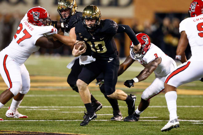 Wake Forest senior quarterback John Wolford wasn't sacked once Saturday in the Demon Deacons' 30-24 win over NC State.