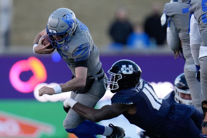 Utah State Aggies defensive end Byron Vaughns (11) sacks Memphis Tigers quarterback Seth Henigan (5) during the second half in the 2022 First Responder Bowl at Gerald J. Ford Stadium. Photo | Chris Jones-USA TODAY Sports