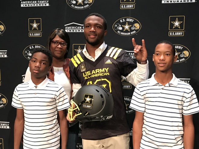 Four-star running back Ricky Person is surrounded by his family at his jersey ceremony.