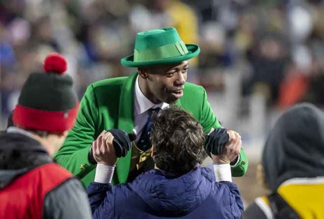 Photo of the Notre Dame Leprechaun doing pushups in the crowd (Photo by Ken Martin).