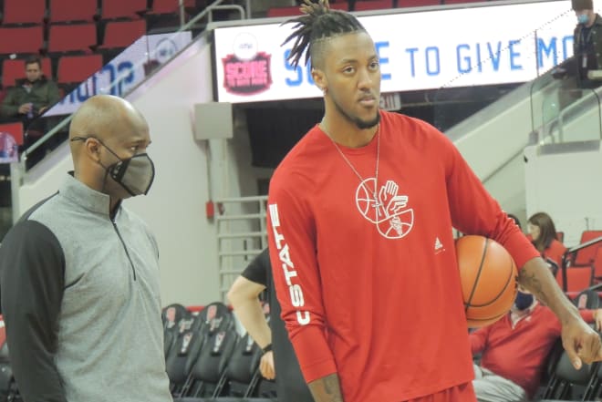 NC State assistant coach James Johnson, left, has departed the program. He is with former NCSU center Manny Bates, who has transferred to Butler.