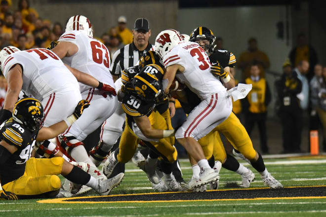 The Iowa defense has their hands full with the Wisconsin run game.