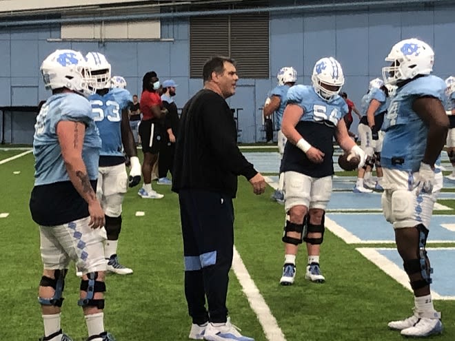 New offensive line coach Jack Bicknell's mission is to make the Tar Heels more aggressive off the snap up from.
