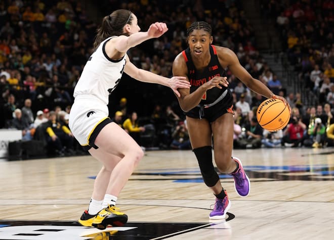 Mar 4, 2023; Minneapolis, MINN, USA; Maryland Terrapins guard Diamond Miller (1) dribbles while Iowa Hawkeyes guard Caitlin Clark (22) defends during the second half at Target Center. 