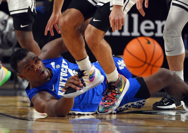Kentucky's Oscar Tshiebwe hit the floor for a lose ball during Tuesday's game at Vanderbilt. 