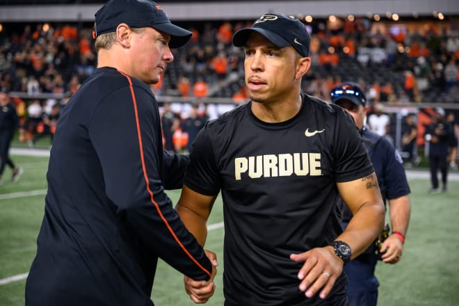 Purdue head coach Ryan Walters, right, shakes hands with Oregon State coach Trent Bray after a 38-21 loss Saturday. Walters said he's "disappointed but hopeful."