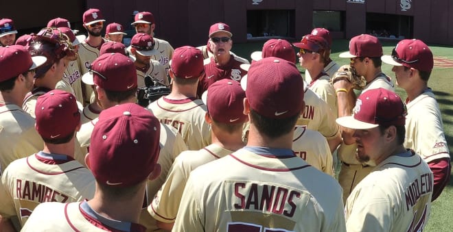 FSU coach Mike Martin talks to his players before Sunday's series finale against Rhode Island.