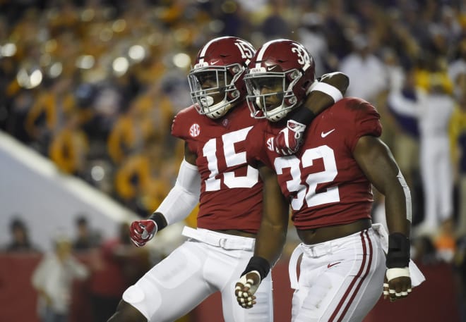 Alabama Crimson Tide linebacker Rashaan Evans (32) and defensive back Ronnie Harrison (15) react after a play against the LSU Tigers during the first quarter at Bryant-Denny Stadium. 