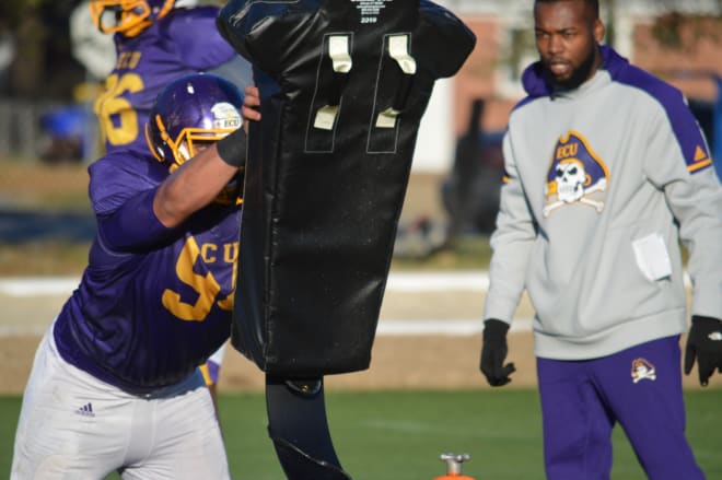 Defensive lineman Alex Turner goes through individual defensive drills as spring practice continues at ECU.