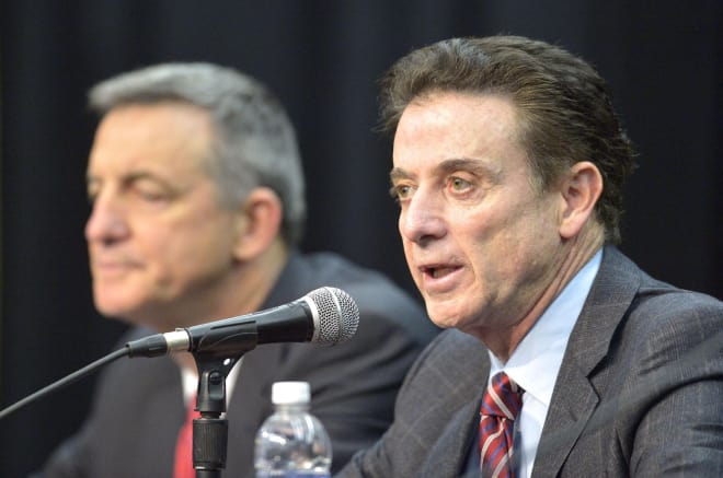 Rick Pitino (right, flanked by private investigator Chuck Smrt) spoke Friday about the pain his team experienced being told they won't be going to the NCAA Tournament this season.