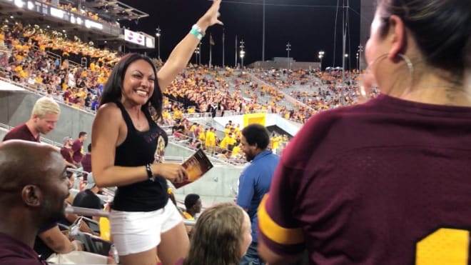 Jayden Daniels' mother, Regina Jackson, celebrates one of her son's three touchdowns in his ASU debut