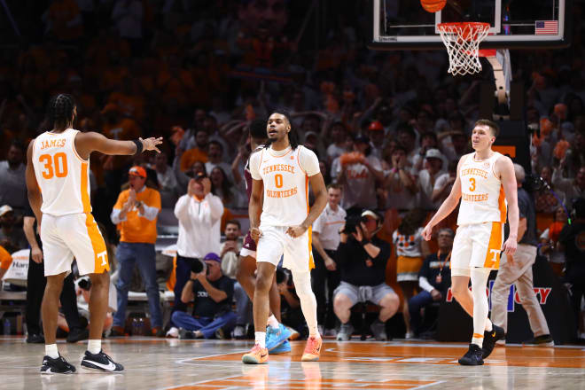 Tennessee forward Jonas Aidoo (0) celebrates with teammates Josiah-Jordan James (30) and Dalton Knecht (3) in the first half of the Vols' win over Texas A&M on Saturday.