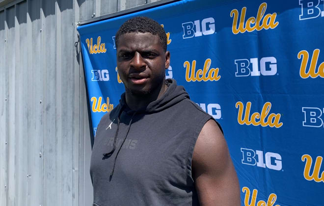 UCLA inside linebacker Oluwafemi Oladejo addresses the media after Wednesday morning’s practice at the Wasserman Football Center practice fields.