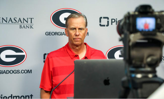 Offensive coordinator Todd Monken talks to the media earlier this year.