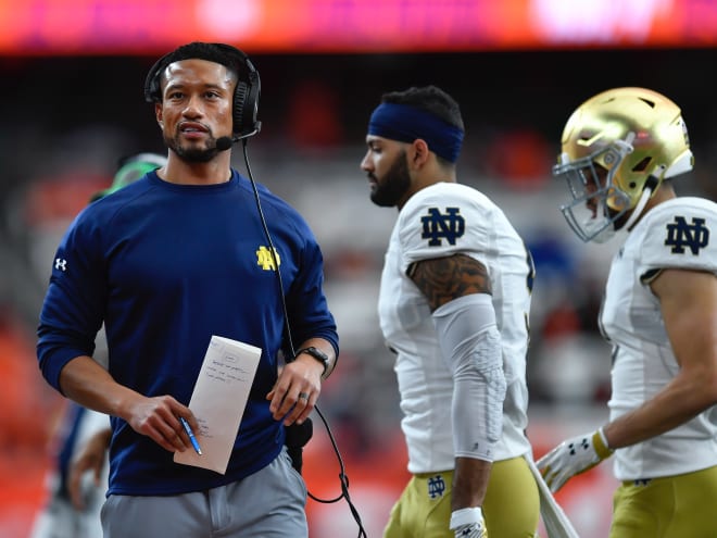 Notre Dame football head coach Marcus Freeman, left, spoke to reporters Saturday.