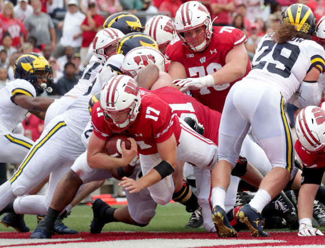 Wisconsin quarterback Jack Coan rushed for two scores against the Wolverines. 