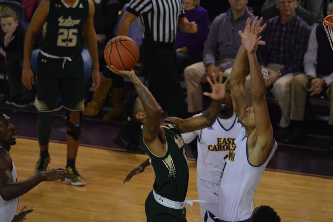 USF's Isaiah Manderson tries to shoot over 7-1 ECU center Andre Washington Wednesday night.