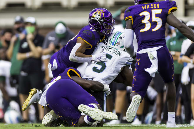 ECU safety Warren Saba brings down Tulane's Stephon Huderson in Saturday's AAC tilt in Greenville.