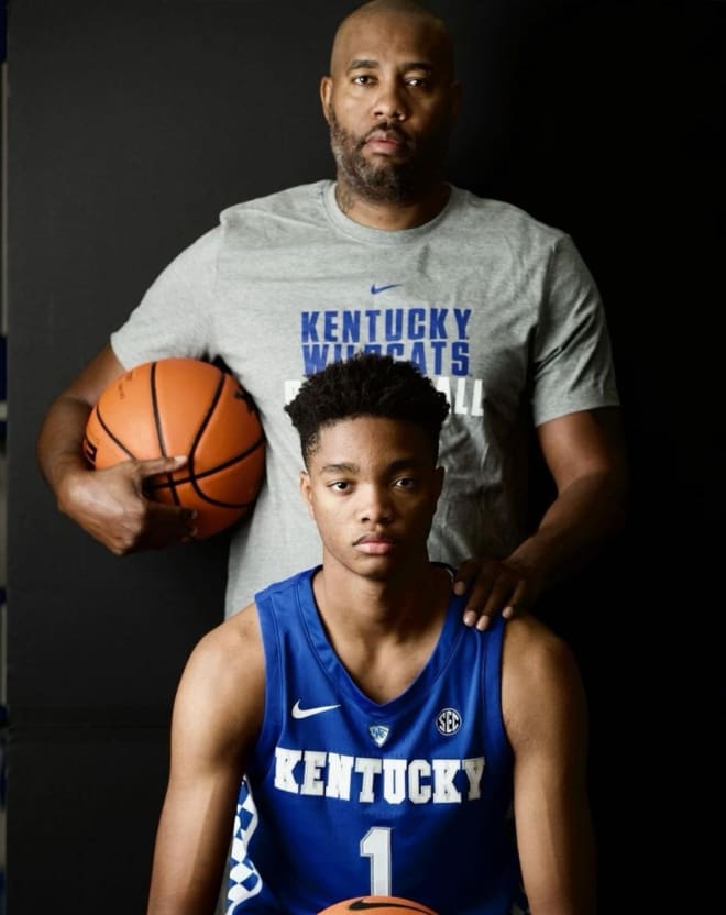 Kwame Evans Jr. and Kwame Evans Sr. posing during the official visit 