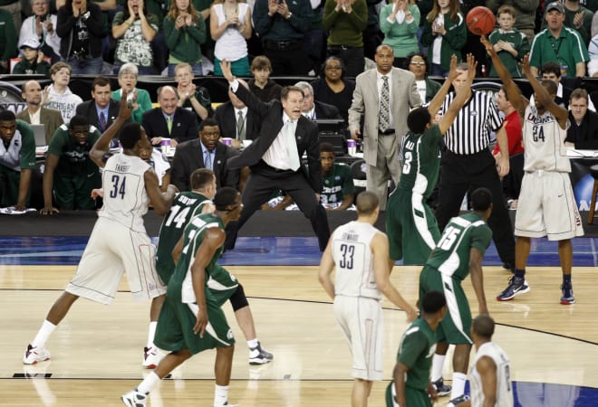 Michigan State Spartans head coach Tom Izzo (center) yells as his team takes on the Connecticut Huskies during the first half of the semifinals of the Final Four in the 2009 NCAA mens basketball tournament at Ford Field. 