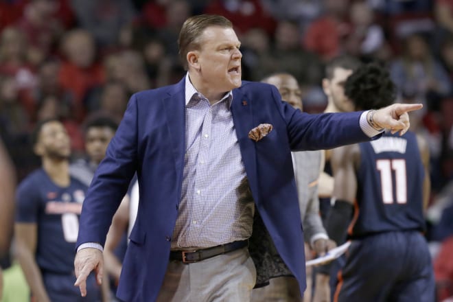 Illinois coach Brad Underwood instructs players during the second half of an NCAA college basketball game against Nebraska in Lincoln, Neb. 