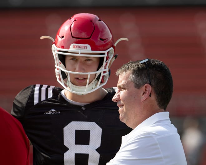 John McNulty talks with former Rutgers quarterback Art Sitkowski during the Scarlet Knights' 2018 spring game (Photo: Peter Ackerman).
