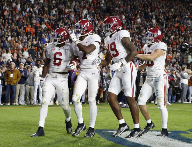Alabama Crimson Tide wide receiver Ja'Corey Brooks (7) celebrates with running back Trey Sanders (6) and tight end Jahleel Billingsley (19) and wide receiver Slade Bolden (18) catching a touchdown pass against the Auburn Tigers. Photo | USA TODAY