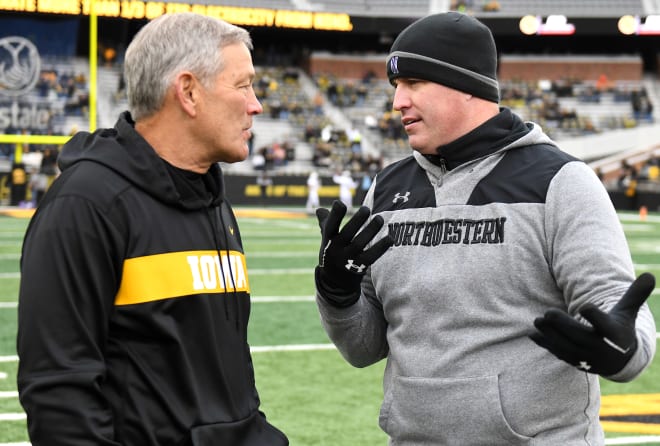  Iowa Hawkeyes football coach Kirk Ferentz, left, talks with Northwestern Wildcats football coach Pat Fitzgerald before a Big Ten Conference football game between the Northwestern Wildcats and the Iowa Hawkeyes