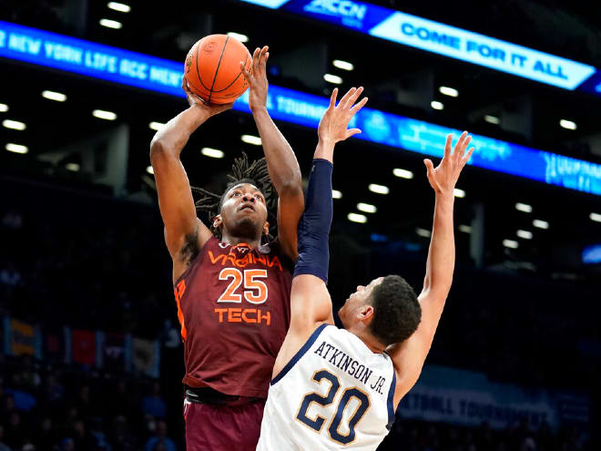 Virginia Tech's Justyn Mutts (25) shoots over Notre Dame's Paul Atkinson Jr. (20) in an 87-80 victory in the ACC Tournament quarterfinals.