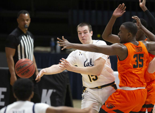 Cal senior Grant Anticevich swings a pass to an open Jarred Hyder 