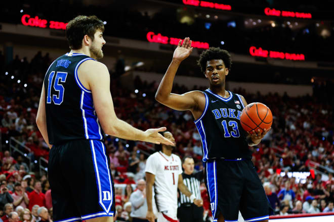 Sean Stewart, right, high-5s Ryan Young during Monday night's win at N.C. State. 