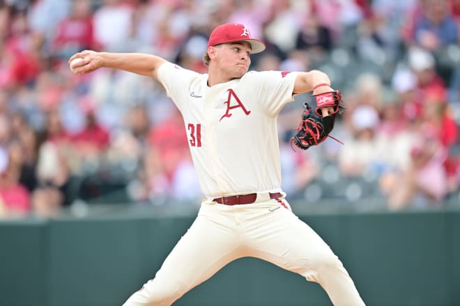 Razorback pitcher Dylan Carter throws during Sunday's game against Alabama. The sophomore was one of three relievers to piece together 8 1/3 innings in the series-clinching defeat of the Crimson Tide.