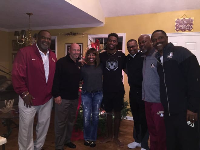 LB Amari Gainer and his family receive a visit from the FSU contingent on Wednesday.