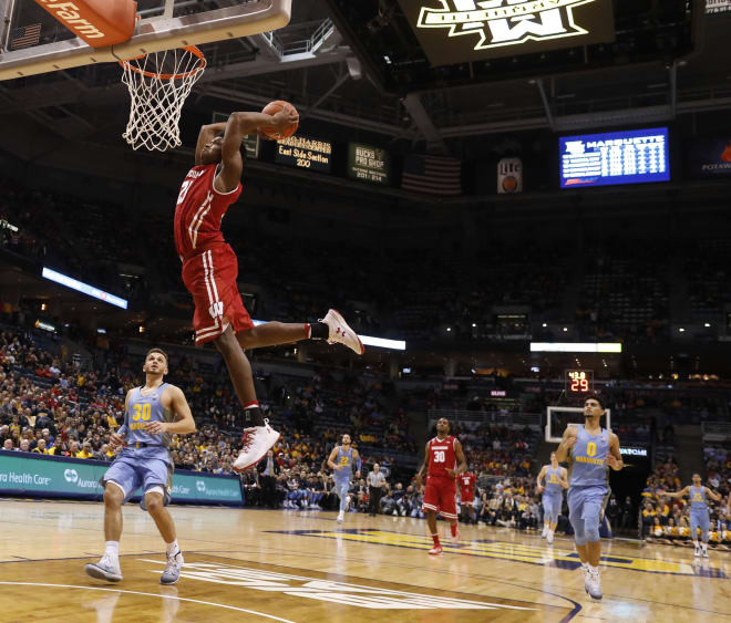 Khalil Iverson of Wisconsin elevates for a dunk versus Marquette. 