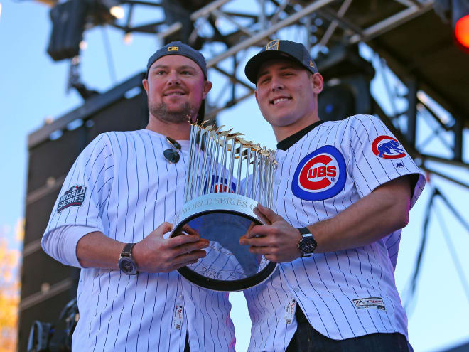 Chicago Cubs pitcher Jon Lester (left) and first baseman Anthony Rizzo pose with the Commissioner's Trophy on Friday in Chicago during the Cubs' World Series championship parade. Photo by USA Today Sports.