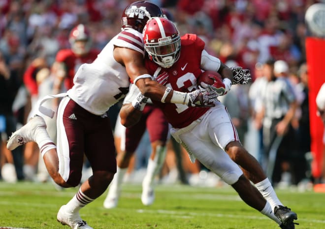 Alabama wide receiver ArDarius Stewart (13) catches a pass and wheels into the end zone for one of his three touchdowns as he is hit by Mississippi State defensive back Mark McLaurin (41) during the Crimson Tide's 51-3 win over western division foe Mississippi State Saturday, November 12, 2016.