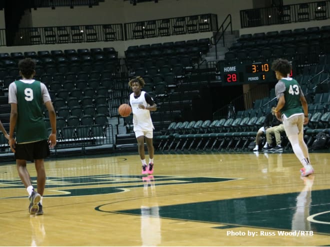 Class of 2021 guard JaVen Smith brings the ball up court at the USF Elite Camp.