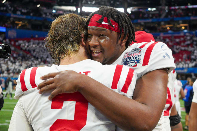 Ole Miss Rebels quarterback Jaxson Dart (2) celebrates with defensive end Jared Ivey (15) after a victory against the Penn State Nittany Lions in the Peach Bowl at Mercedes-Benz Stadium. Mandatory Credit: Brett Davis-USA TODAY Sports