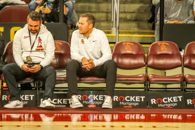 Brandon Sosna and Lincoln Riley at a USC basketball game last season.