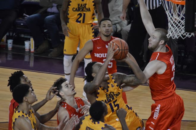 East Carolina's Kentrell Barkley drives on a host of Cougars in Houston's 74-58 win over the Pirates.