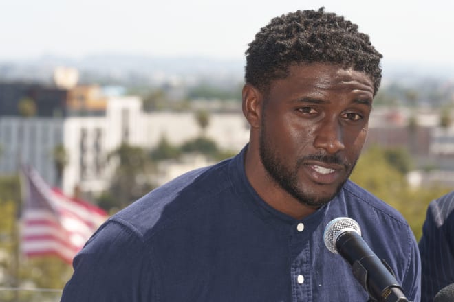 Reggie Bush holds a news conference atop the Coliseum on Wednesday morning.