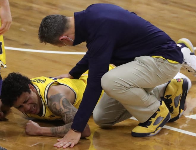 Michigan Wolverines Senior guard Eli Brooks went down early with an ankle injury at Michigan State. His prognosis is unknown.