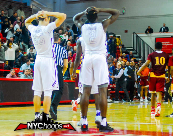 Adrien Nunez and Keith Williams watch Terry Dawkins walk off with the ball and the win