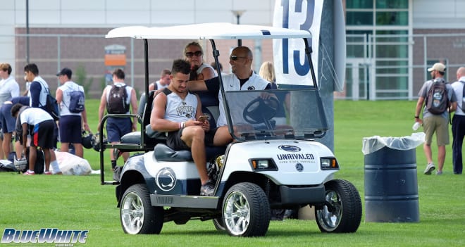 WR Julian Fleming relaxes with James Franklin during June's LionStrong 7-on-7 Tournament.