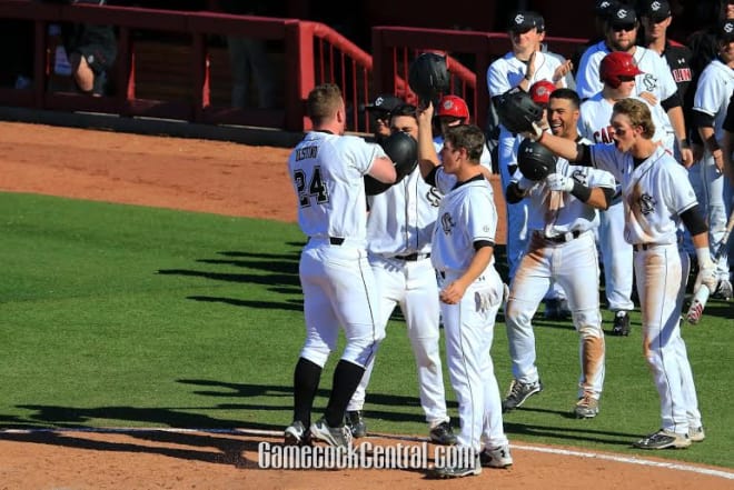 Alex Destino is greeted at home plate after hitting a HR in Saturday's win