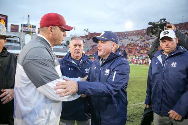 Brian Kelly (right) and USC's Clay Helton will face off Oct. 21 in South Bend.